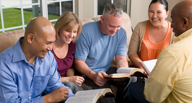 small group spending time together reading their Bibles